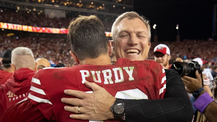 San Francisco 49ers quarterback Brock Purdy (L) and general manager John Lynch (R)