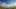 Blue cloudy sky above open country road
