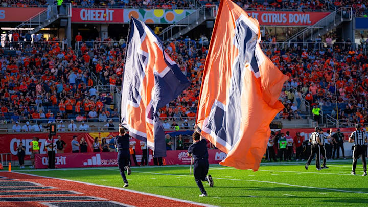 The Illini flags are run across the field at Camping World Stadium in Orlando, Florida, during Illinois' 21-17 win over South Carolina in  the Citrus Bowl on Dec. 31, 2024.