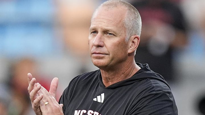 Sep 7, 2024; Charlotte, North Carolina, USA; North Carolina State Wolfpack head coach Dave Doeren during pregame activities against the Tennessee Volunteers at the Dukes Mayo Classic at Bank of America Stadium. Mandatory Credit: Jim Dedmon-Imagn Images