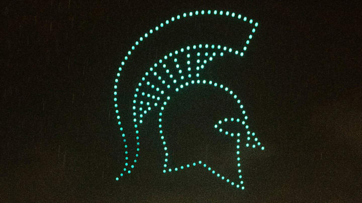 MSU students watch a drone show with a Spartan logo in the air during Izzone Campout at Munn Field near Breslin Center in East Lansing on Friday, Oct. 6, 2023.