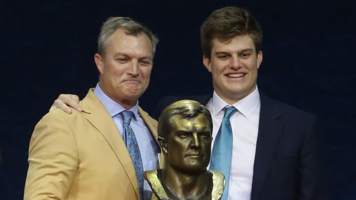 Aug 8, 2021; Canton, Ohio, USA; Inductee John Lynch (left) and presenter son Jake Lynch (right) pose with the bust of John during the Class of 2021 NFL Hall of Fame induction ceremony at Tom Benson Hall of Fame Stadium. Mandatory Credit: Charles LeClaire-USA TODAY Sports