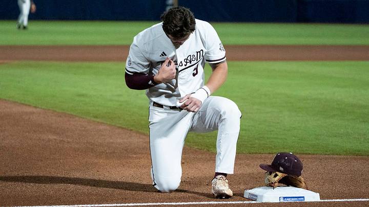 Texas A&M Aggies' Gavin Grahovac (9) prays before Auburn Tigers take on Texas A&M Aggies during the SEC baseball tournament at Hoover Metropolitan Stadium in Hoover, Ala. on Friday, May 22, 2026. Texas A&M Aggies' Gavin Grahovac (9) prays before Auburn Tigers take on Texas A&M Aggies during the SEC baseball tournament at Hoover Metropolitan Stadium in Hoover, Ala. on Friday, May 22, 2026.