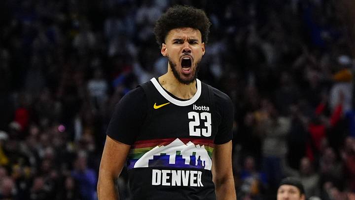 Apr 4, 2026; Denver, Colorado, USA; Denver Nuggets forward Cameron Johnson (23) reacts to his three point score in overtime against the San Antonio Spurs at Ball Arena. Mandatory Credit: Ron Chenoy-Imagn Images