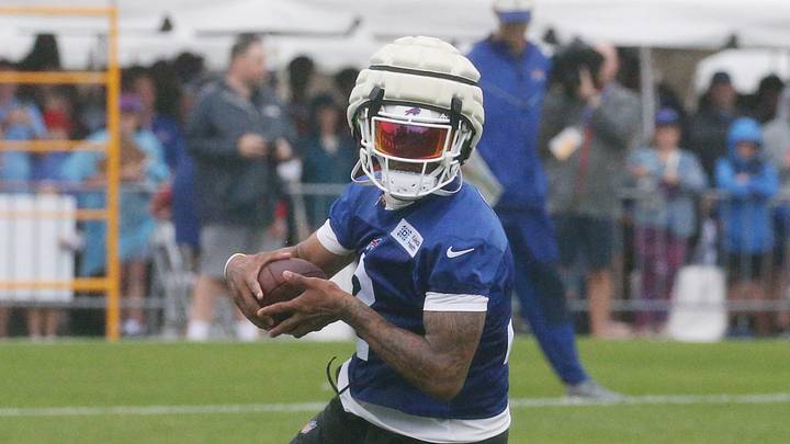 Buffalo Bills wide receiver DJ Moore heads up field after a catch Buffalo Bills wide receiver DJ Moore heads up field after a catch