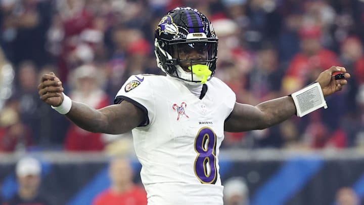 Dec 25, 2024; Houston, Texas, USA;  Baltimore Ravens quarterback Lamar Jackson (8) reacts under center against the Houston Texans in the first quarter at NRG Stadium. Mandatory Credit: Thomas Shea-Imagn Images
