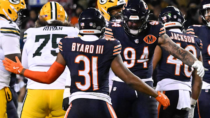 Jan 10, 2026; Chicago, IL, USA; in Chicago Bears safety Kevin Byard III (31) and defensive end Austin Booker (94) celebrate after sacking Green Bay Packers quarterback Jordan Love (10) during an NFC Wild Card Round game at Soldier Field. Mandatory Credit: Matt Marton-Imagn Images
