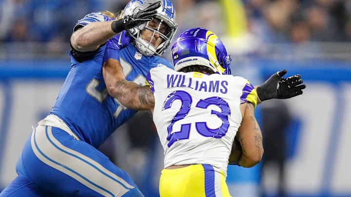 Detroit Lions linebacker Alex Anzalone tackles L.A. Rams running back Kyren Williams