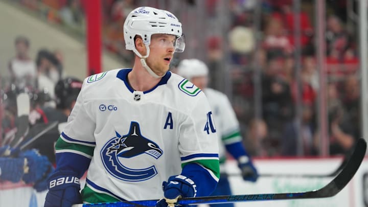 Jan 10, 2025; Raleigh, North Carolina, USA;  Vancouver Canucks center Elias Pettersson (40) skates against the Carolina Hurricanes during the third period at Lenovo Center. Mandatory Credit: James Guillory-Imagn Images