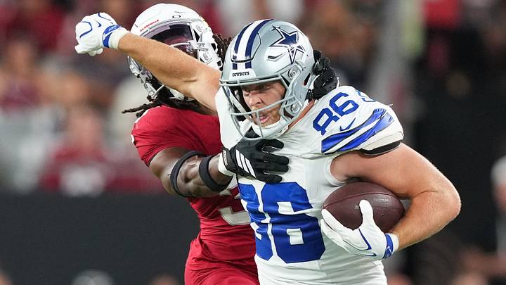 Dallas Cowboys tight end Luke Schoonmaker delivers a stiff arm to Arizona Cardinals safety Kitan Crawford Dallas Cowboys tight end Luke Schoonmaker delivers a stiff arm to Arizona Cardinals safety Kitan Crawford