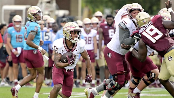 Apr 20, 2024; Tallahassee, Florida, USA; Florida State Seminoles running back Jaylin Lucas (13) runs with the ball during the Spring Showcase at Doak S. Campbell Stadium. Mandatory Credit: Melina Myers-Imagn Images