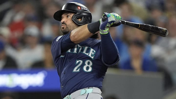 Oct 20, 2025; Toronto, Ontario, CAN; Seattle Mariners third baseman Eugenio Suarez (28) hits a single against the Toronto Blue Jays in the second inning during game seven of the ALCS round for the 2025 MLB playoffs at Rogers Centre.  Mandatory Credit: John E. Sokolowski-Imagn Images