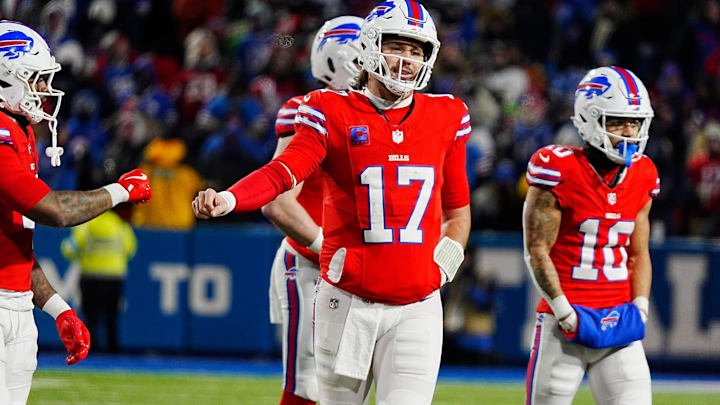 Buffalo Bills RB James Cook and QB Josh Allen fist bump after a play during second half action at Highmark Stadium. Buffalo Bills RB James Cook and QB Josh Allen fist bump after a play during second half action at Highmark Stadium.