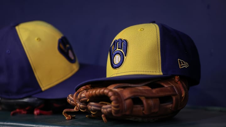Jul 28, 2023; Atlanta, Georgia, USA; A detailed view of a Milwaukee Brewers hat and glove on the bench against the Atlanta Braves in the second inning at Truist Park. Mandatory Credit: Brett Davis-Imagn Images Jul 28, 2023; Atlanta, Georgia, USA; A detailed view of a Milwaukee Brewers hat and glove on the bench against the Atlanta Braves in the second inning at Truist Park. Mandatory Credit: Brett Davis-Imagn Images
