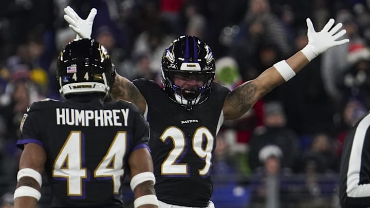 Dec 21, 2025; Baltimore, Maryland, USA;  Baltimore Ravens safety Ar'Darius Washington (29) celebrates forcing a fumble by New England Patriots quarterback Drake Maye (not pictured) during the first half of the game at M&T Bank Stadium. Mandatory Credit: James Lang-Imagn Images