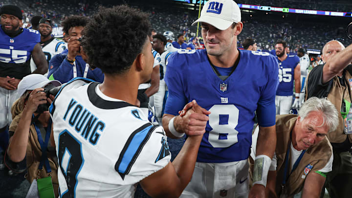 Aug 18, 2023; East Rutherford, New Jersey, USA; Carolina Panthers quarterback Bryce Young (9) shakes hands with New York Giants quarterback Daniel Jones (8) after the preseason game at MetLife Stadium. 