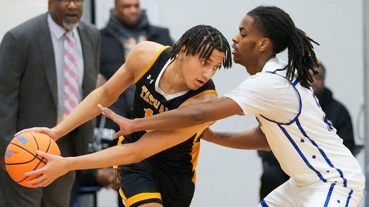 Tatnall’s Mason Collins (left) guards the ball from Howard’s Dominic Awahmukalah in Howard’s 72-62 win in the second round of the DIAA state tournament, March 5, 2026 at Howard. Tatnall’s Mason Collins (left) guards the ball from Howard’s Dominic Awahmukalah in Howard’s 72-62 win in the second round of the DIAA state tournament, March 5, 2026 at Howard.