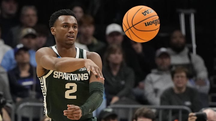 March 23, 2024, Charlotte, NC, USA;  Michigan State Spartans guard Tyson Walker (2) passes the ball