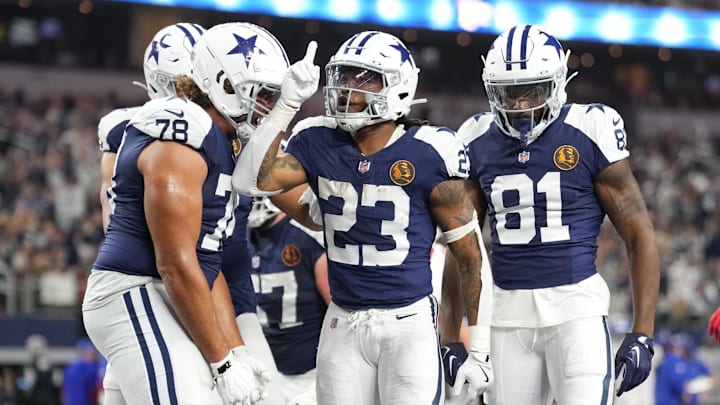Dallas Cowboys running back Rico Dowdle celebrates with teammates after scoring a touchdown against the New York Giants.