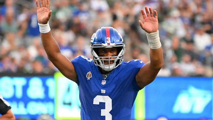 Aug 16, 2025; East Rutherford, New Jersey, USA; New York Giants quarterback Russell Wilson (3) gestures for a touchdown against the New York Jets during the first half during the first half at MetLife Stadium. Mandatory Credit: Rich Barnes-Imagn Images