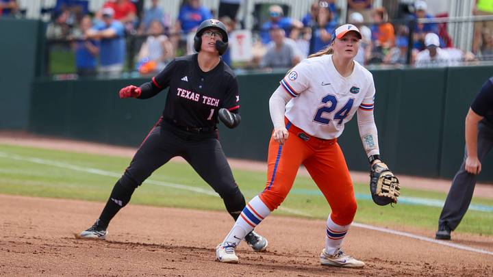 Florida infielder Madison Walker (24) looks for the throw while Texas Tech second baseman Mia Williams (1) contemplates a steal during game 3 of the super regional of the NCAA Division 1 softball championship at Katie Seashole Pressly Stadium in Gainesville, FL on Sunday, May 24, 2026. [Alan Youngblood/Gainesville Sun]