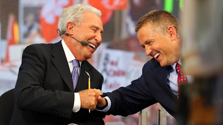 Lee Corso and Kirk Herbstreit joke around during the live broadcast of ESPN College GameDay at Sundance Square in 2015.