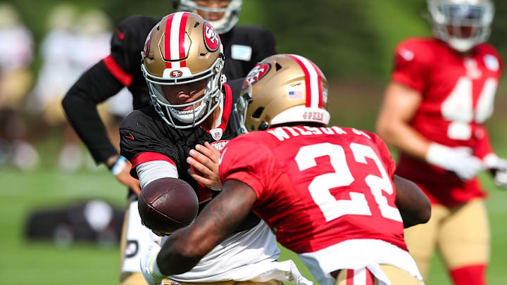 San Francisco 49ers quarterback Brock Purdy (13) and running back Jeff Wilson Jr. (22)