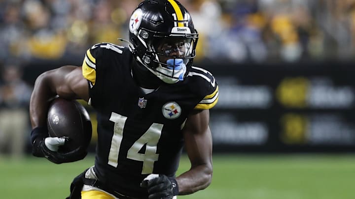 Oct 6, 2024; Pittsburgh, Pennsylvania, USA;  Pittsburgh Steelers wide receiver George Pickens (14) runs after a catch against the Dallas Cowboys during the fourth quarter at Acrisure Stadium. Dallas won 20-17. Mandatory Credit: Charles LeClaire-Imagn Images