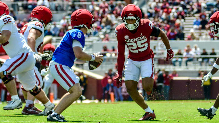 Oklahoma safety Michael Boganowski chases after quarterback Bowe Bentley during the spring game.