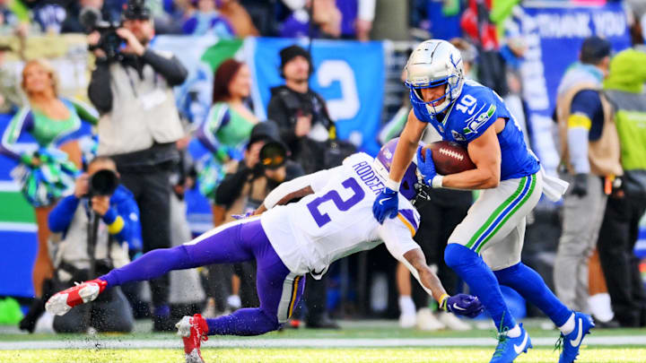 Nov 30, 2025; Seattle, Washington, USA; Seattle Seahawks wide receiver Cooper Kupp (10) stiff arms Minnesota Vikings cornerback Isaiah Rodgers (2) during the first half against the Minnesota Vikings at Lumen Field. Mandatory Credit: Steven Bisig-Imagn Images
