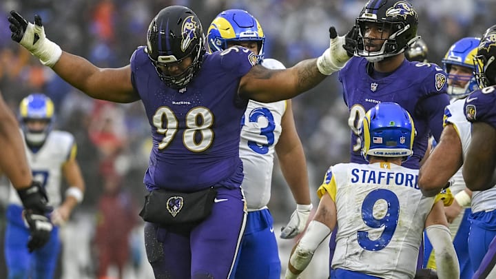 Dec 10, 2023; Baltimore, Maryland, USA; Baltimore Ravens defensive tackle Travis Jones (98) reacts after sacking Los Angeles Rams quarterback Matthew Stafford (9)  during the second  half at M&T Bank Stadium. Mandatory Credit: Tommy Gilligan-Imagn Images