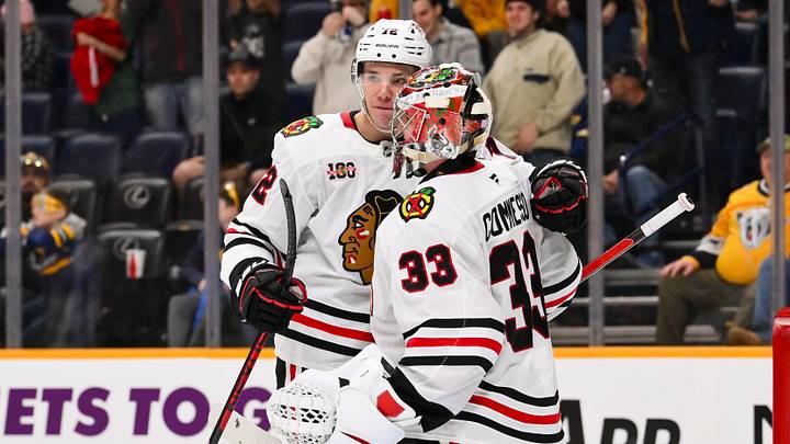 Jan 10, 2026; Nashville, Tennessee, USA; Chicago Blackhawks goaltender Drew Commesso (33) celebrates the win with defenseman Alex Vlasic (72) against the Nashville Predators during the third period at Bridgestone Arena. Mandatory Credit: Steve Roberts-Imagn Images Jan 10, 2026; Nashville, Tennessee, USA; Chicago Blackhawks goaltender Drew Commesso (33) celebrates the win with defenseman Alex Vlasic (72) against the Nashville Predators during the third period at Bridgestone Arena. Mandatory Credit: Steve Roberts-Imagn Images