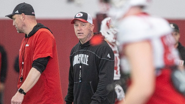 Louisville head football coach Jeff Brohm oversees practice on April 12, 2024 before the Red-White