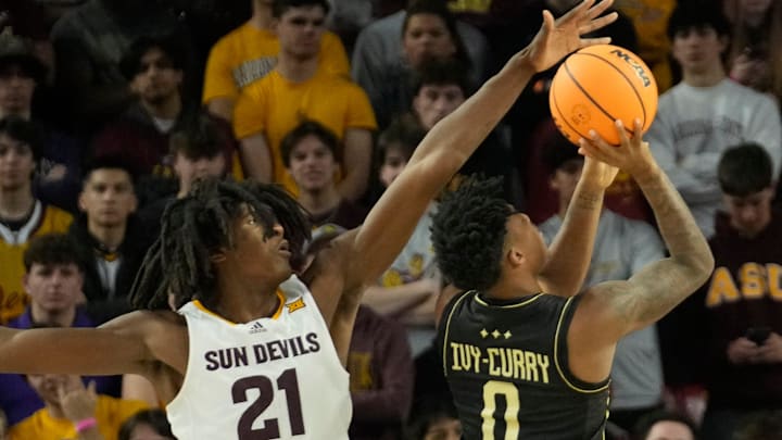 UCF guard Jordan Ivy-Curry (0) has his shot blocked by Arizona State forward Jayden Quaintance (21) during Big 12 play at Desert Financial Arena in Tempe.
