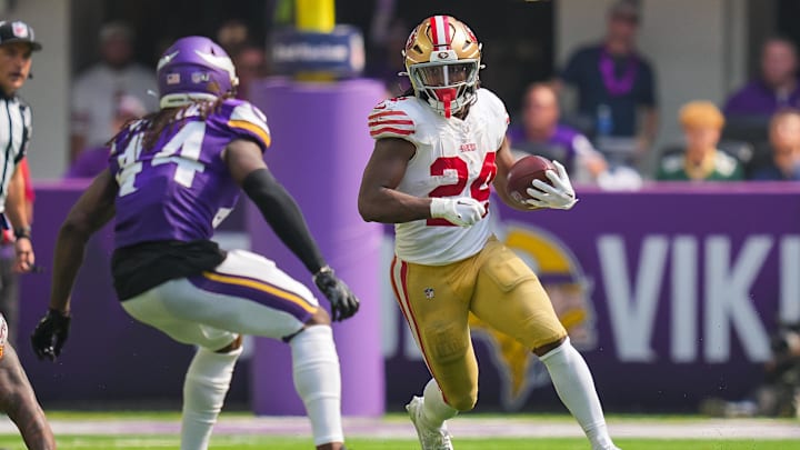Sep 15, 2024; Minneapolis, Minnesota, USA; San Francisco 49ers running back Jordan Mason (24) runs with the ball against the Minnesota Vikings in the third quarter at U.S. Bank Stadium. Mandatory Credit: Brad Rempel-Imagn Images Sep 15, 2024; Minneapolis, Minnesota, USA; San Francisco 49ers running back Jordan Mason (24) runs with the ball against the Minnesota Vikings in the third quarter at U.S. Bank Stadium. Mandatory Credit: Brad Rempel-Imagn Images