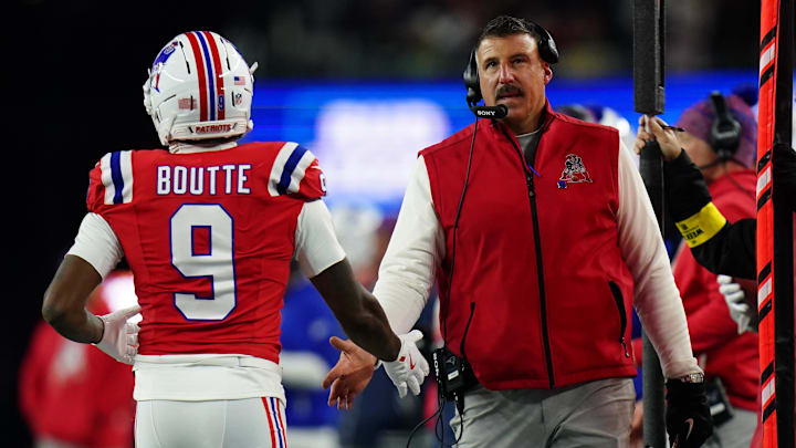 Dec 1, 2025; Foxborough, Massachusetts, USA; New England Patriots wide receiver Kayshon Boutte (9) high-fives New England Patriots head coach Mike Vrabel on the sideline during the third quarter at Gillette Stadium. Mandatory Credit: David Butler II-Imagn Images