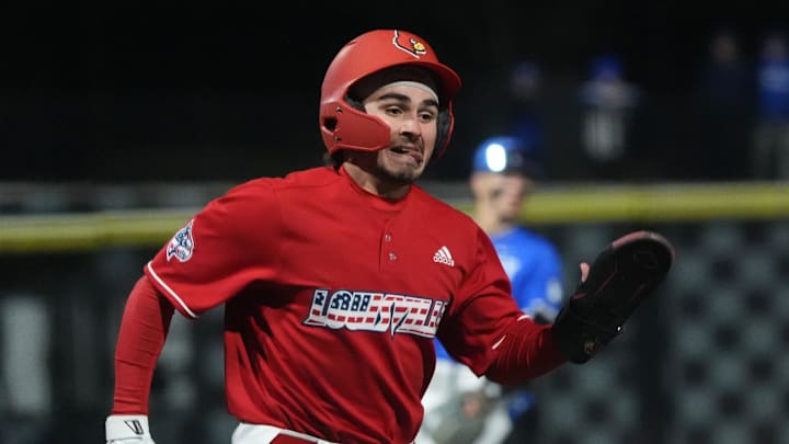 Louisville's Griffin Crain (6) makes it home for the score against Kentucky at Kentucky Proud Park.
