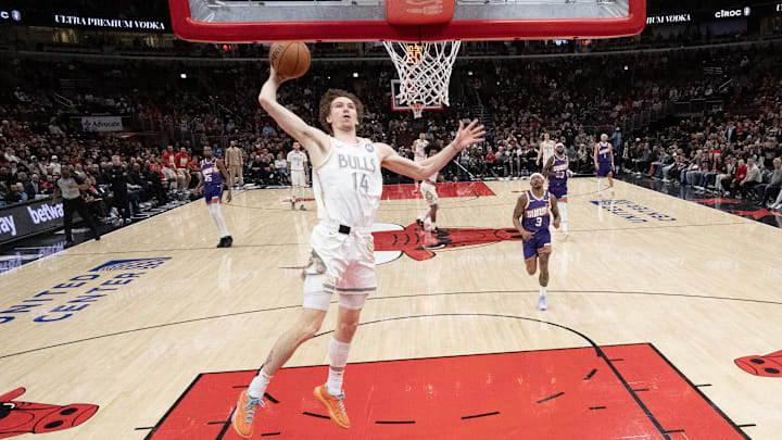 Feb 22, 2025; Chicago, Illinois, USA; Chicago Bulls forward Matas Buzelis (14) goes up for a dunk against the Phoenix Suns during the first half at United Center. Mandatory Credit: David Banks-Imagn Images