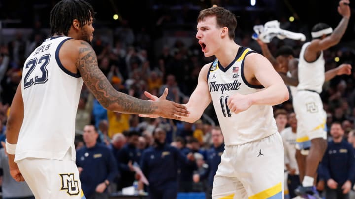 Marquette Golden Eagles forward David Joplin (23) and Marquette Golden Eagles guard Tyler Kolek (11) celebrate after NCAA Men’s Basketball Tournament game against the Colorado Buffaloes, Sunday, March 24, 2024, at Gainbridge Fieldhouse in Indianapolis. Marquette Golden Eagles won 81-77.