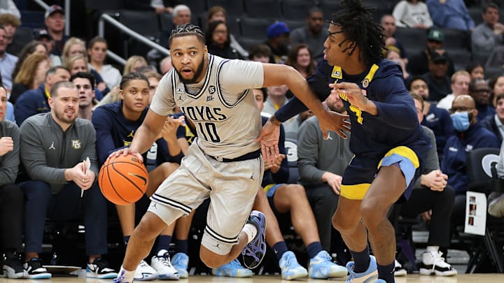 Mar 1, 2025; Washington, District of Columbia, USA; Georgetown Hoyas guard Jayden Epps (10) dribbles the ball past Marquette Golden Eagles guard Zaide Lowery (7) during the first half at Capital One Arena. Mandatory Credit: Daniel Kucin Jr.-Imagn Images
