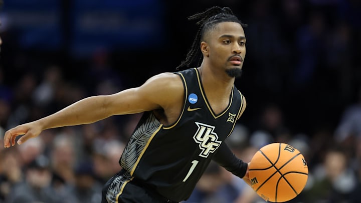 Mar 20, 2026; Philadelphia, PA, USA; UCF Knights guard Themus Fulks (1) dribbles the ball against the UCLA Bruins in the first half during a first round game of the men's 2026 NCAA Tournament at Xfinity Mobile Arena. Mandatory Credit: Bill Streicher-Imagn Images