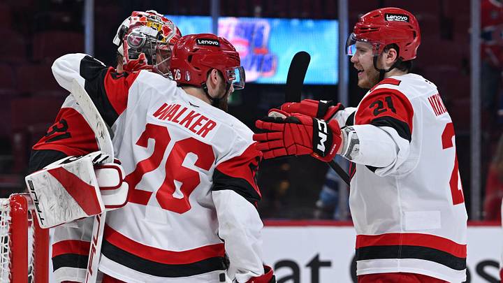 May 27, 2026; Montreal, Quebec, CAN; Carolina Hurricanes defenseman Sean Walker (26), defenseman Alexander Nikishin (21) and goaltender Frederik Andersen (31) react after defeating the Montreal Canadiens in game four of the Eastern Conference Final of the 2026 Stanley Cup Playoffs at Bell Centre. Mandatory Credit: David Kirouac-Imagn Images