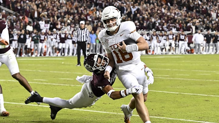 Texas Longhorns quarterback Arch Manning breaks the attempted tackle from Texas A&M Aggies defensive back Marcus Ratcliffe Texas Longhorns quarterback Arch Manning breaks the attempted tackle from Texas A&M Aggies defensive back Marcus Ratcliffe