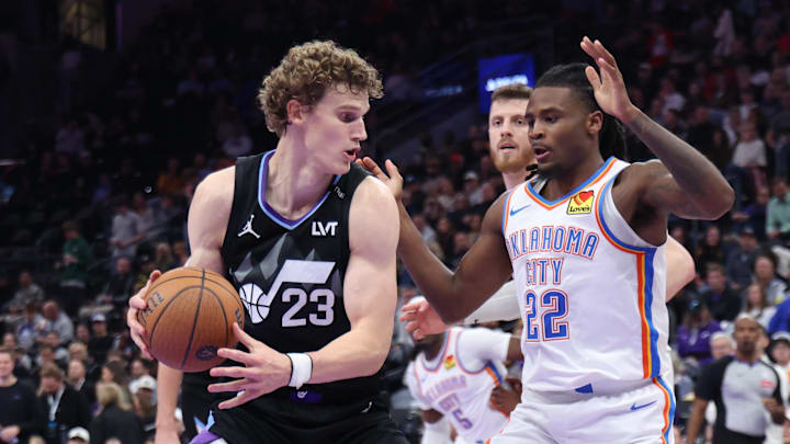 Nov 21, 2025; Salt Lake City, Utah, USA; Utah Jazz forward Lauri Markkanen (23) posts up against Oklahoma City Thunder guard Cason Wallace (22) during the second half at Delta Center. Mandatory Credit: Rob Gray-Imagn Images