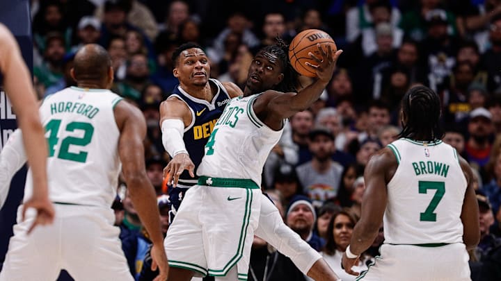 Jan 7, 2025; Denver, Colorado, USA; Boston Celtics guard Jrue Holiday (4) and Denver Nuggets guard Russell Westbrook (4) battle for the ball as center Al Horford (42) and guard Jaylen Brown (7) in the third quarter at Ball Arena. Mandatory Credit: Isaiah J. Downing-Imagn Images