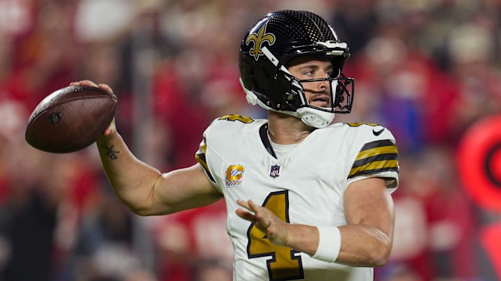 Oct 7, 2024; Kansas City, Missouri, USA; New Orleans Saints quarterback Derek Carr (4) throws a pass during the first half against the Kansas City Chiefs at GEHA Field at Arrowhead Stadium. Mandatory Credit: Jay Biggerstaff-Imagn Images