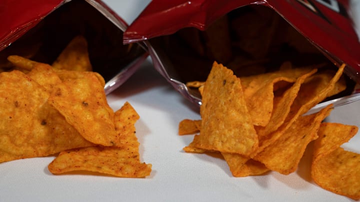 A high school football star in Maryland was swarmed and detained by police when an AI detection system at his school falsely flagged an empty bag of Doritos he was carrying as a gun. A high school football star in Maryland was swarmed and detained by police when an AI detection system at his school falsely flagged an empty bag of Doritos he was carrying as a gun.