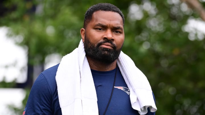 Jul 24, 2024; Foxborough, MA, USA; New England Patriots head coach Jerod Mayo walks to the podium for a press conference before training camp at Gillette Stadium. Mandatory Credit: Eric Canha-USA TODAY Sports Jul 24, 2024; Foxborough, MA, USA; New England Patriots head coach Jerod Mayo walks to the podium for a press conference before training camp at Gillette Stadium. Mandatory Credit: Eric Canha-USA TODAY Sports