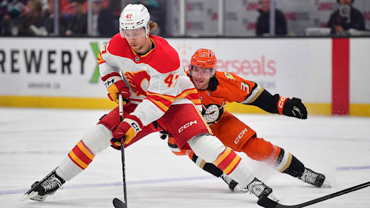 Jan 7, 2025; Anaheim, California, USA; Calgary Flames center Connor Zary (47) moves the puck ahead of Anaheim Ducks center Jansen Harkins (38) during the first period at Honda Center. Mandatory Credit: Gary A. Vasquez-Imagn Images Jan 7, 2025; Anaheim, California, USA; Calgary Flames center Connor Zary (47) moves the puck ahead of Anaheim Ducks center Jansen Harkins (38) during the first period at Honda Center. Mandatory Credit: Gary A. Vasquez-Imagn Images