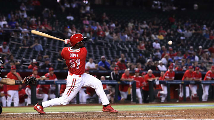 Mar 12, 2023; Phoenix, Arizona, USA; Team Canada Otto Lopez (51) gets a hit against Team Canada at